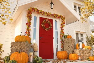 autumn decorated house with pumpkins and hay autumn decorated house with pumpkins and hay