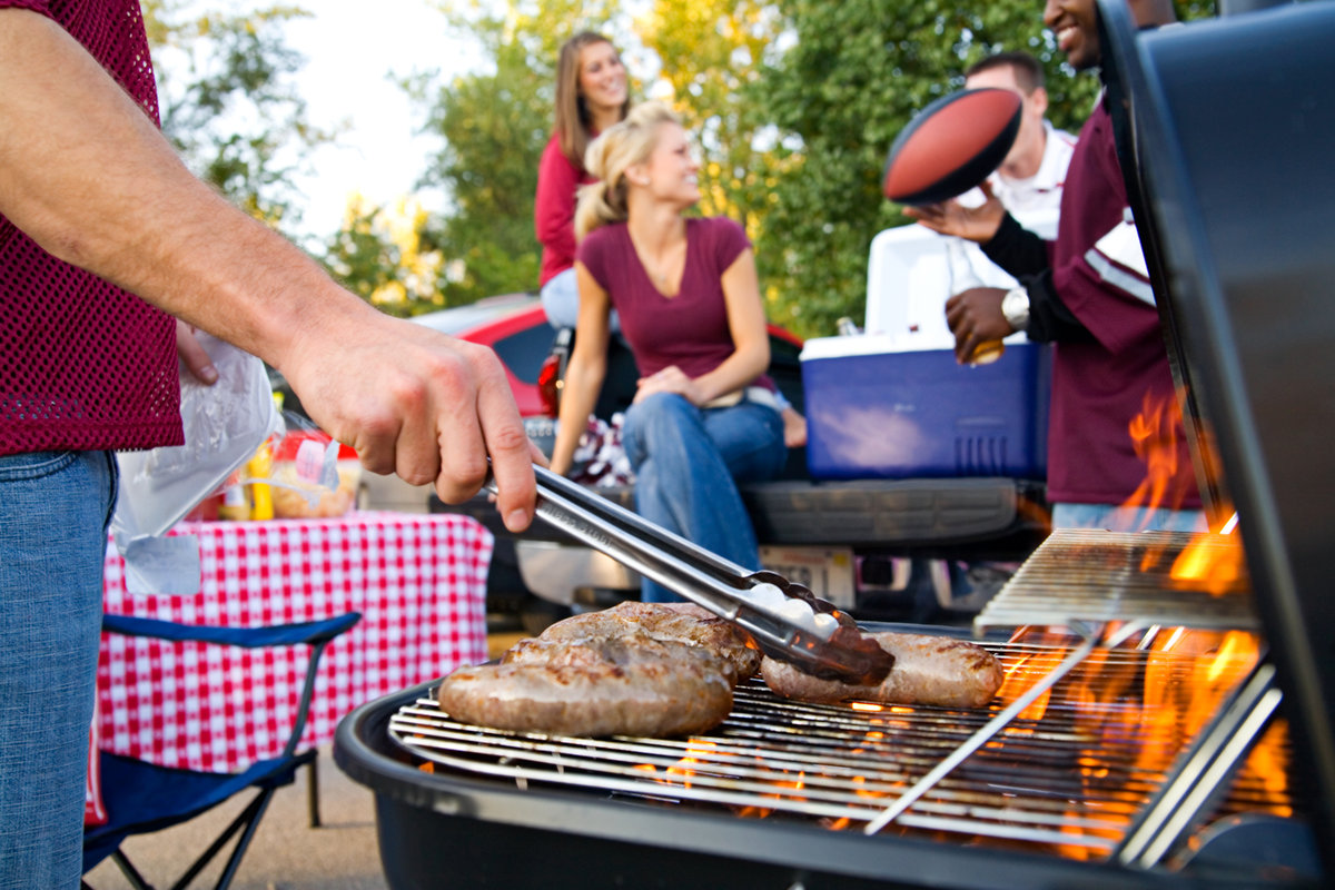 tailgating party with people and grill