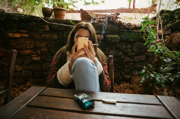 Lady on her phone smoking