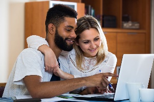 Couple sitting at computer