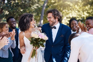 Couple celebrating wedding with family and friends