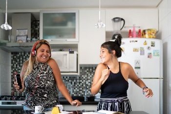 Mother and daughter listening to music