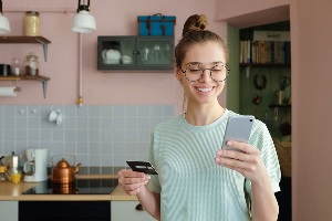 Excited woman looking at phone