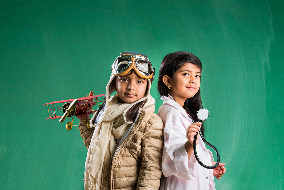 Two kids dressed as a doctor and pilot