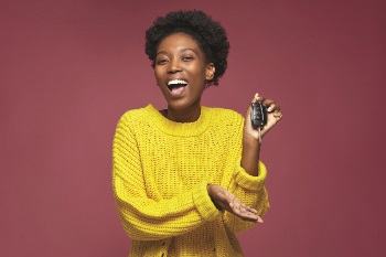 Girl looking excited showing off her car keys