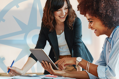 compass-page-graphics-debt-coaching Two women collaborating on a tablet