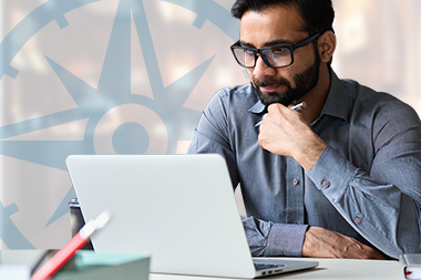 compass-page-graphics-online-calculators Guy contemplating something on his laptop