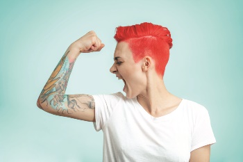 Girl with tattoo sleeve looking motivated