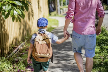 father-walking-son-to-school