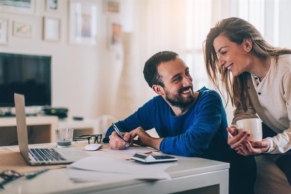 husband and wife researching banking options