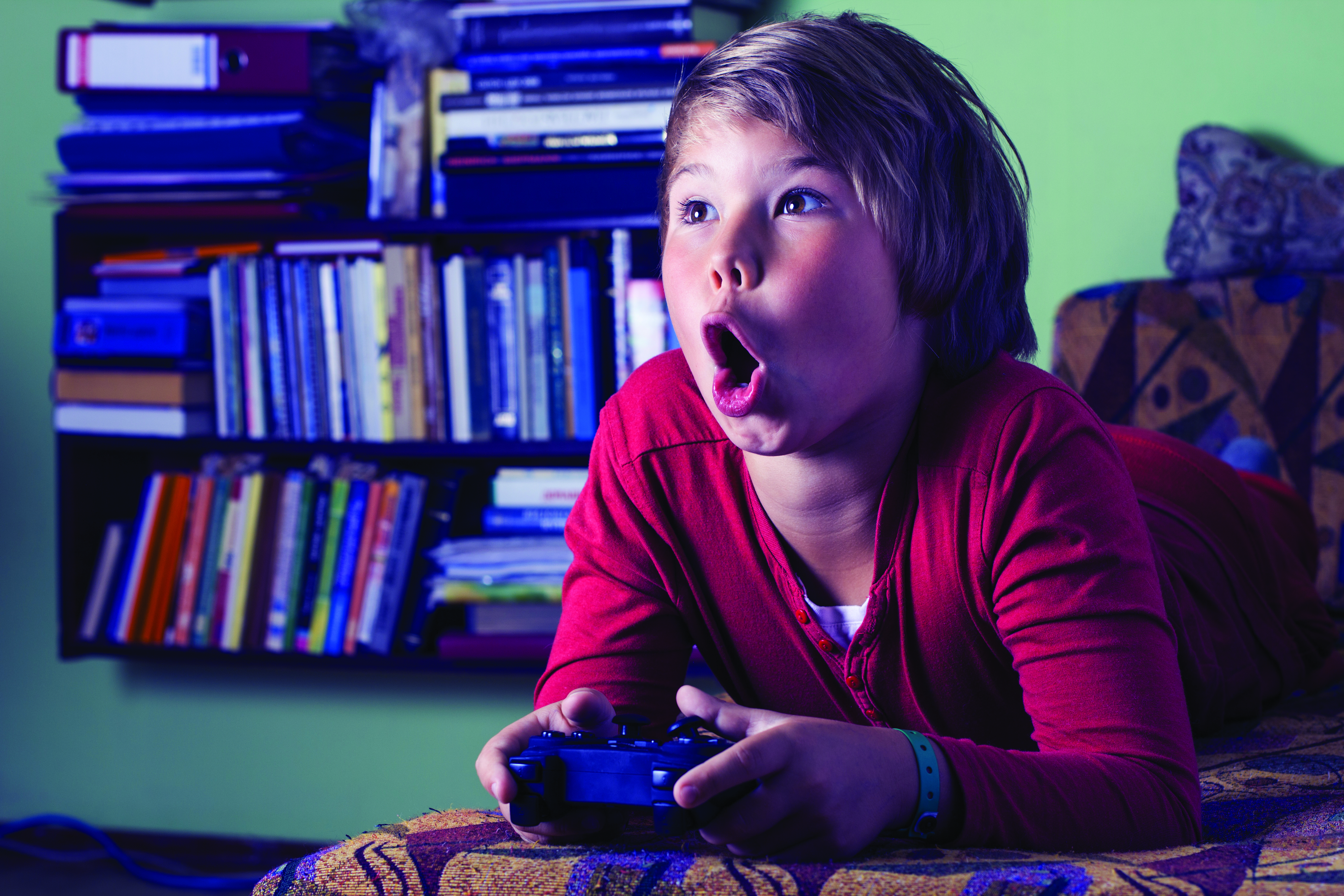 Kid playing video game