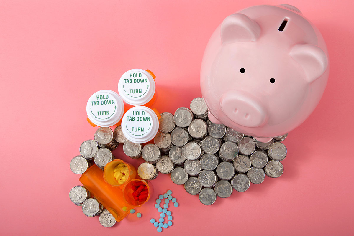 Piggy bank with change and prescription pill bottles