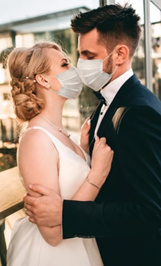 Couple getting married with masks