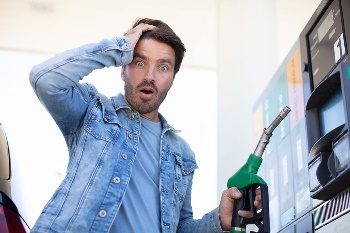 Man confused at gas pump