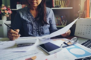 Woman at desk doing taxes