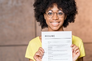 woman holding up resume