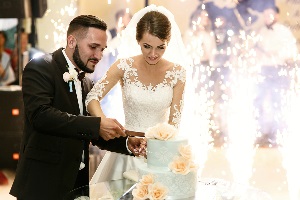 Married couple cutting their wedding cake