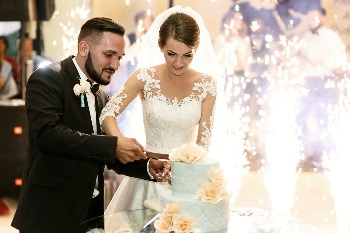 Married couple cutting their wedding cake