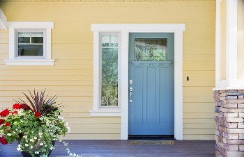 yellow house with painted front door