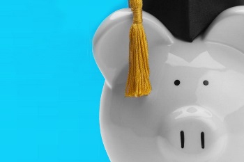 Piggy bank with graduation hat