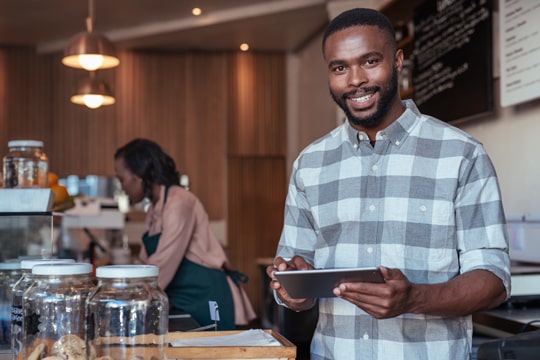 Coffee Shop Owner with Tablet