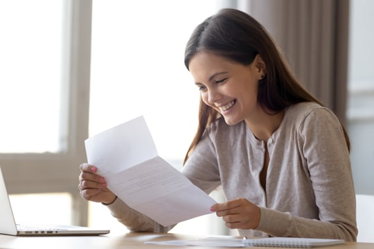 Girl reading scholarship letter