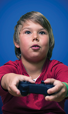 Kid playing video games