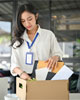 Woman, laid off, packing her desk