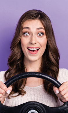 Woman with steering wheel