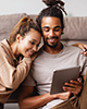 Couple looking at tablet